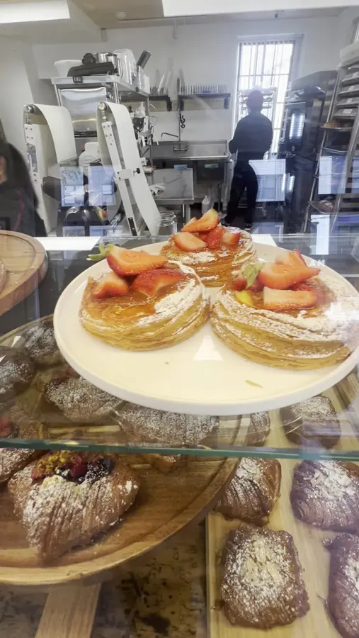 Tarts on cake stands in the bakery